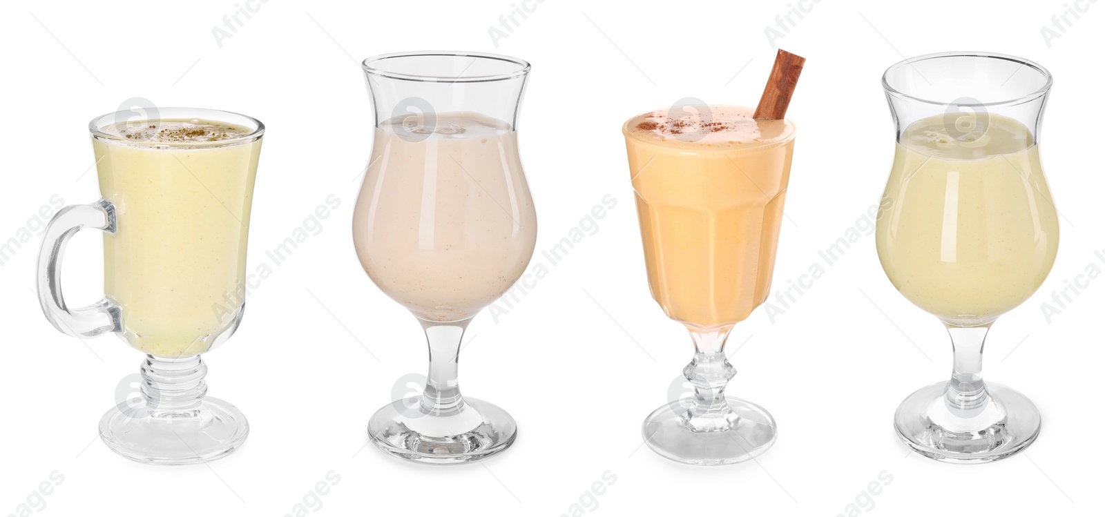 Image of Delicious eggnog in glasses isolated on white, set