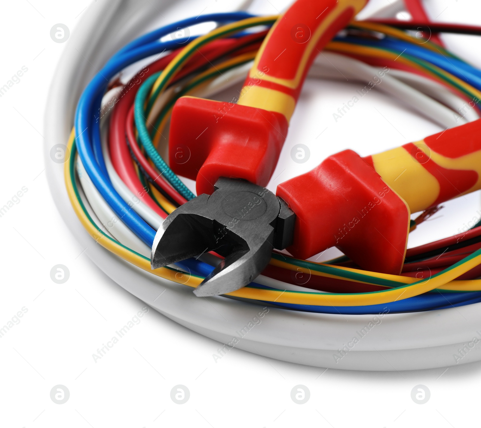 Photo of Colorful cables and cutting pliers on white background, closeup with space for text. Electrician's tool