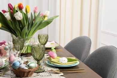 Photo of Festive table setting with beautiful flowers, space for text. Easter celebration