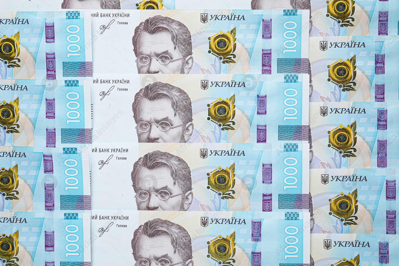 Photo of Ukrainian money as background, top view. National currency