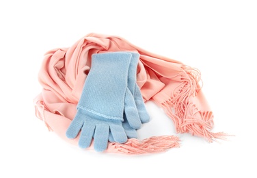 Photo of Stylish gloves and scarf on white background. Autumn clothes