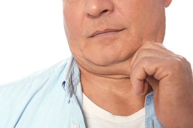 Mature man with double chin on white background, closeup