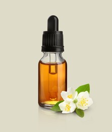 Image of Bottle of jasmine essential oil and flowers on light background