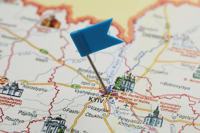 Photo of MYKOLAIV, UKRAINE - NOVEMBER 09, 2020: Kyiv city marked with push pin on map of Ukraine, closeup