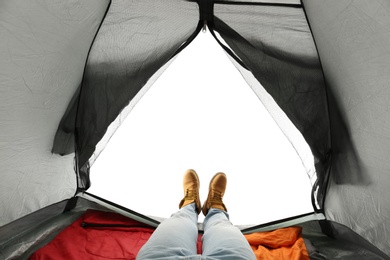 Closeup of man in camping tent on white background, view from inside