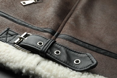 Photo of Brown suede jacket as background, closeup view