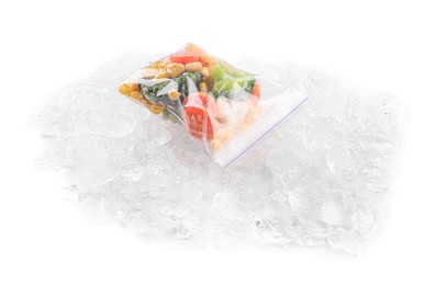 Bag of different frozen vegetables and ice isolated on white