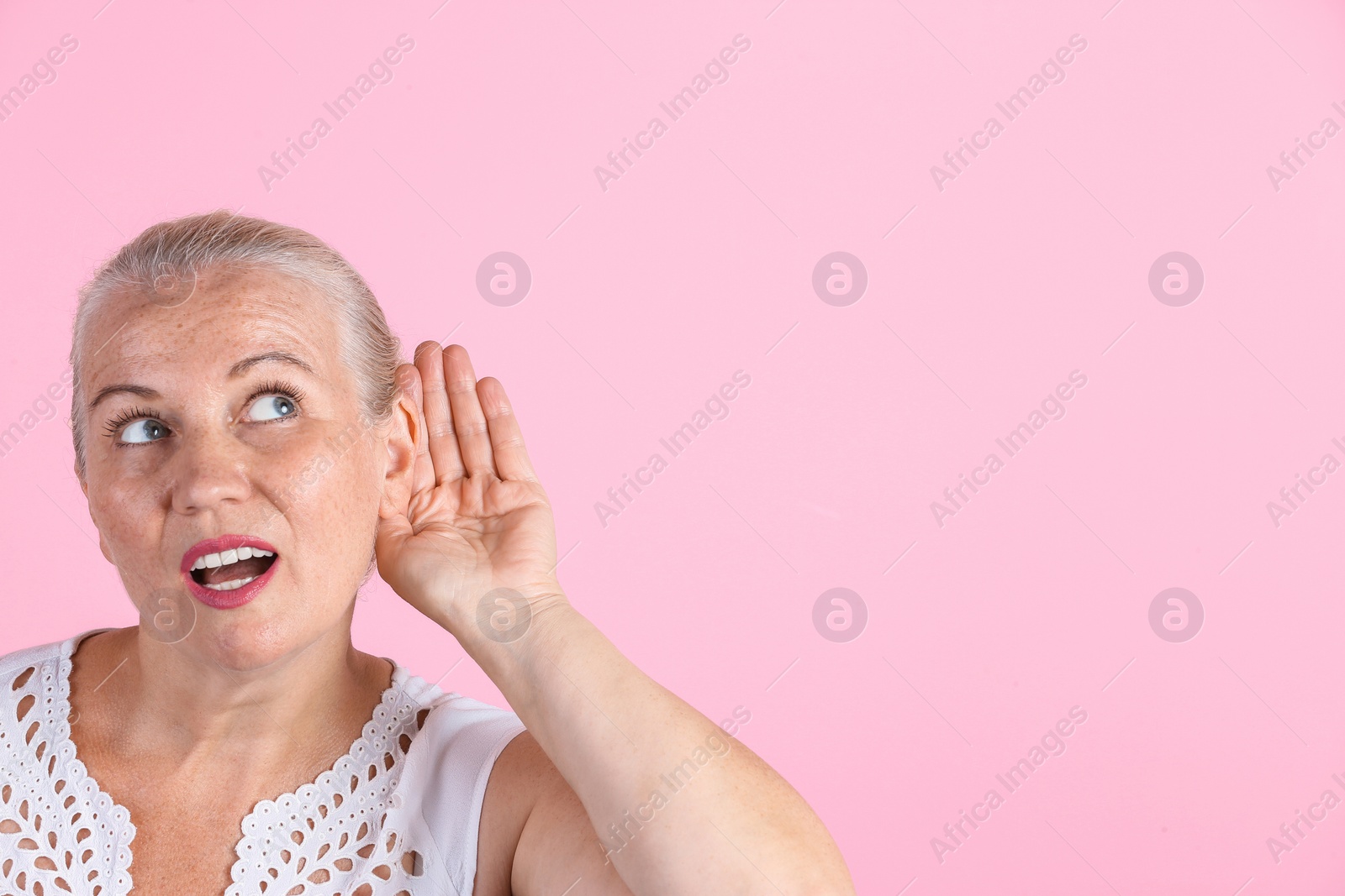 Photo of Mature woman with hearing problem on color background. Space for text