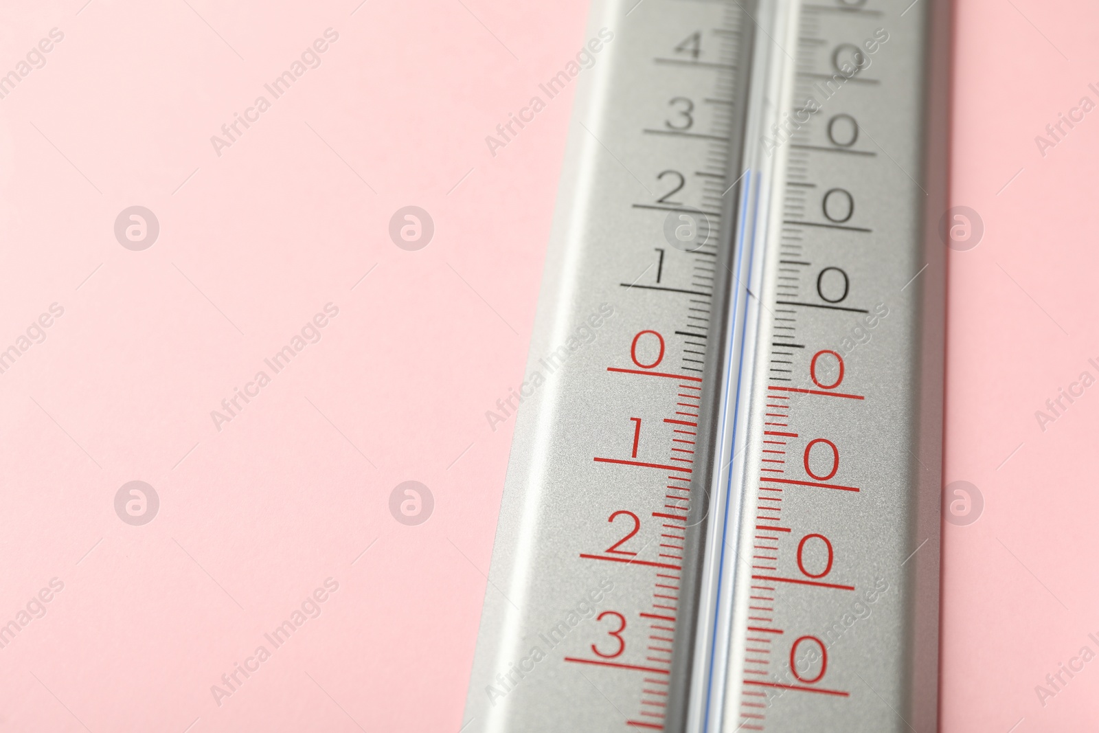 Photo of Weather thermometer on pink background, closeup. Space for text