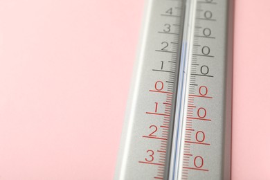 Photo of Weather thermometer on pink background, closeup. Space for text