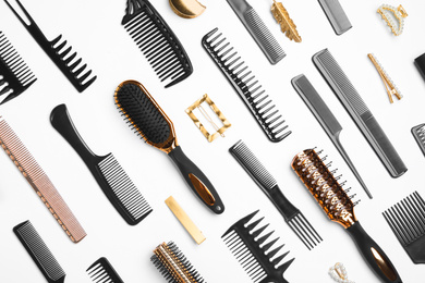 Composition with hair combs and brushes on white background, top view