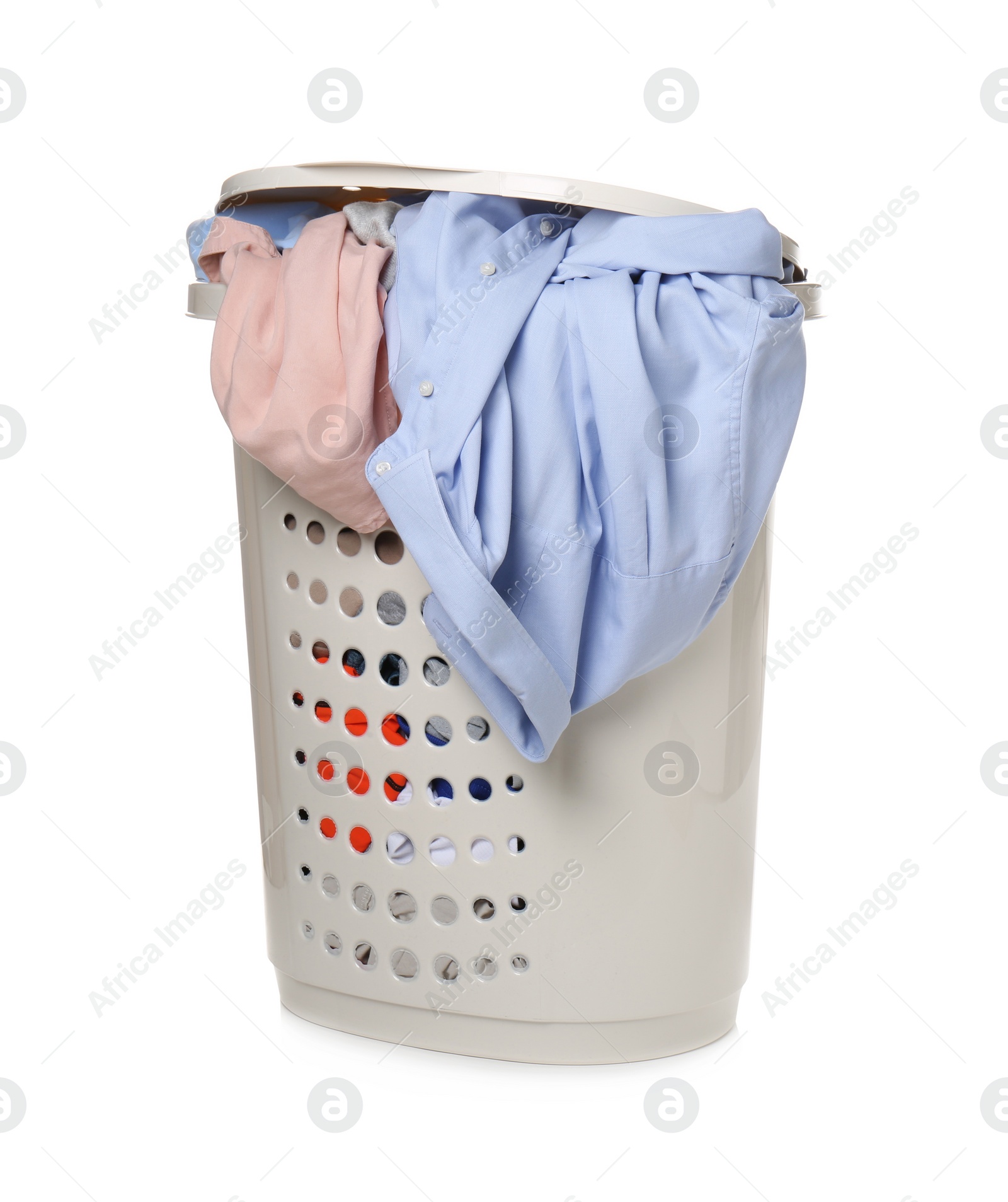 Photo of Plastic laundry basket full of clothes isolated on white