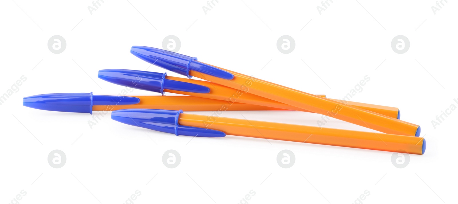 Photo of New orange plastic pens isolated on white