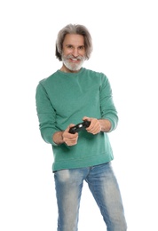 Photo of Emotional mature man playing video games with controller isolated on white