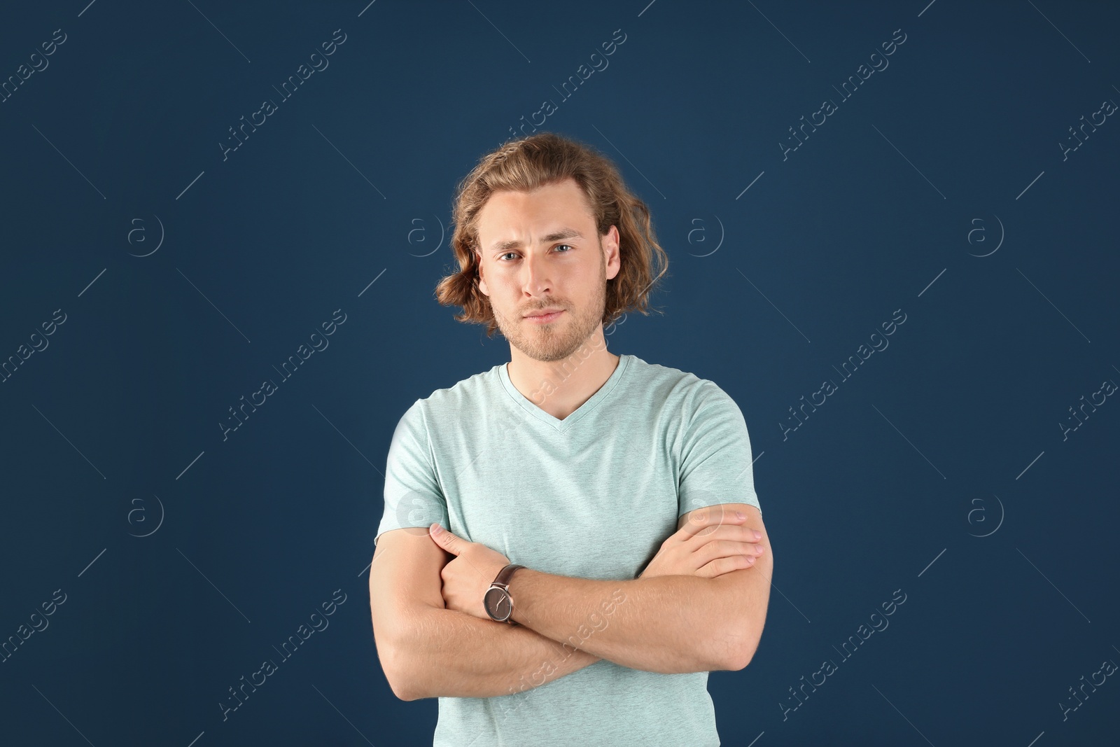 Photo of Portrait of handsome man on color background