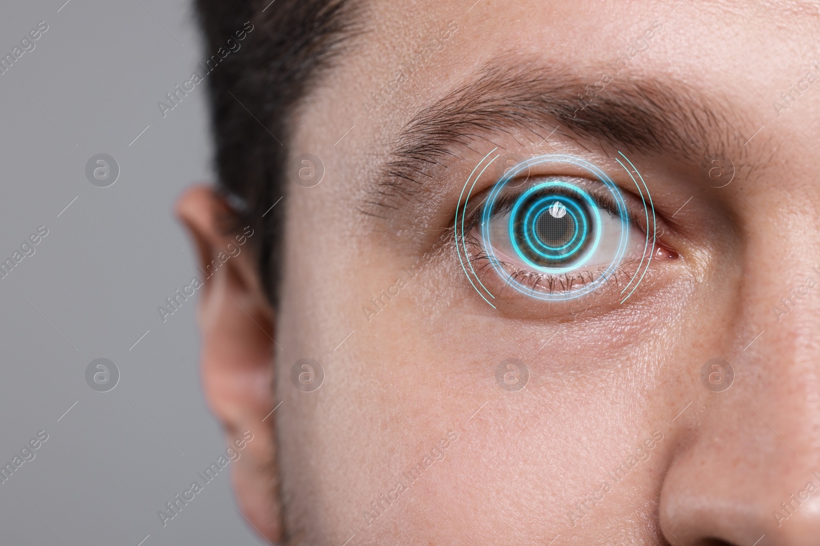 Image of Vision test. Man and digital scheme focused on his eye against grey background, closeup