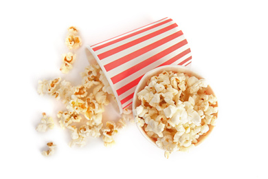 Photo of Buckets of tasty pop corn isolated on white, top view