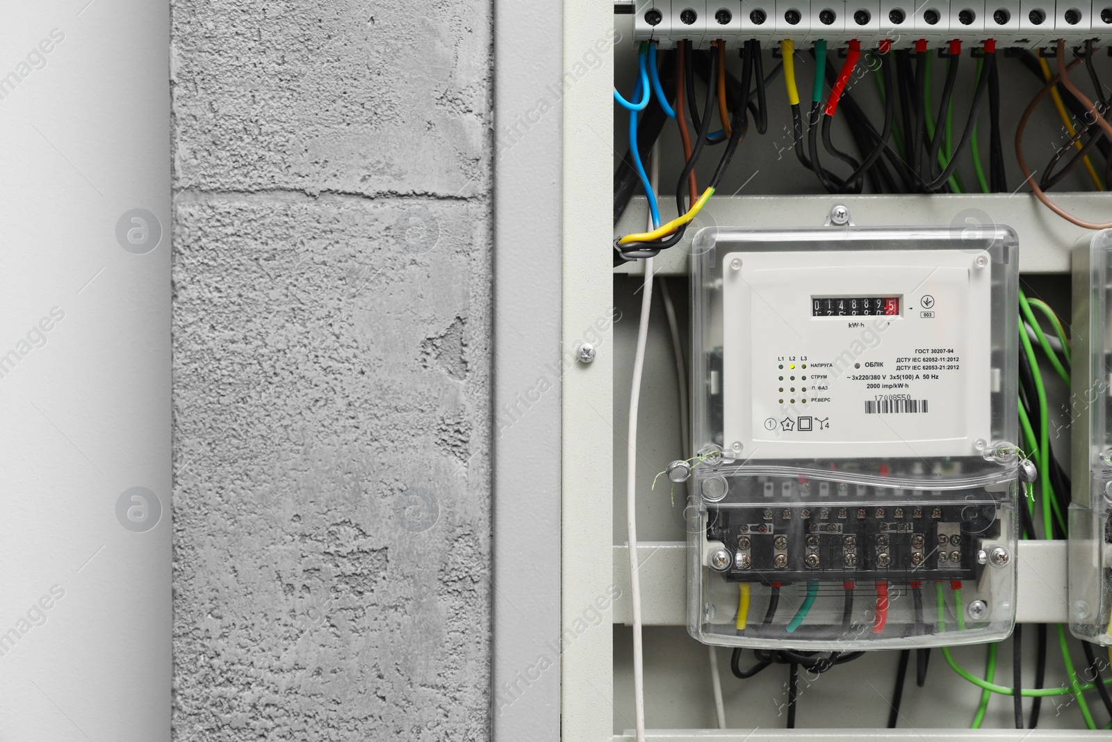 Photo of Electric meter and wires in fuse box, space for text