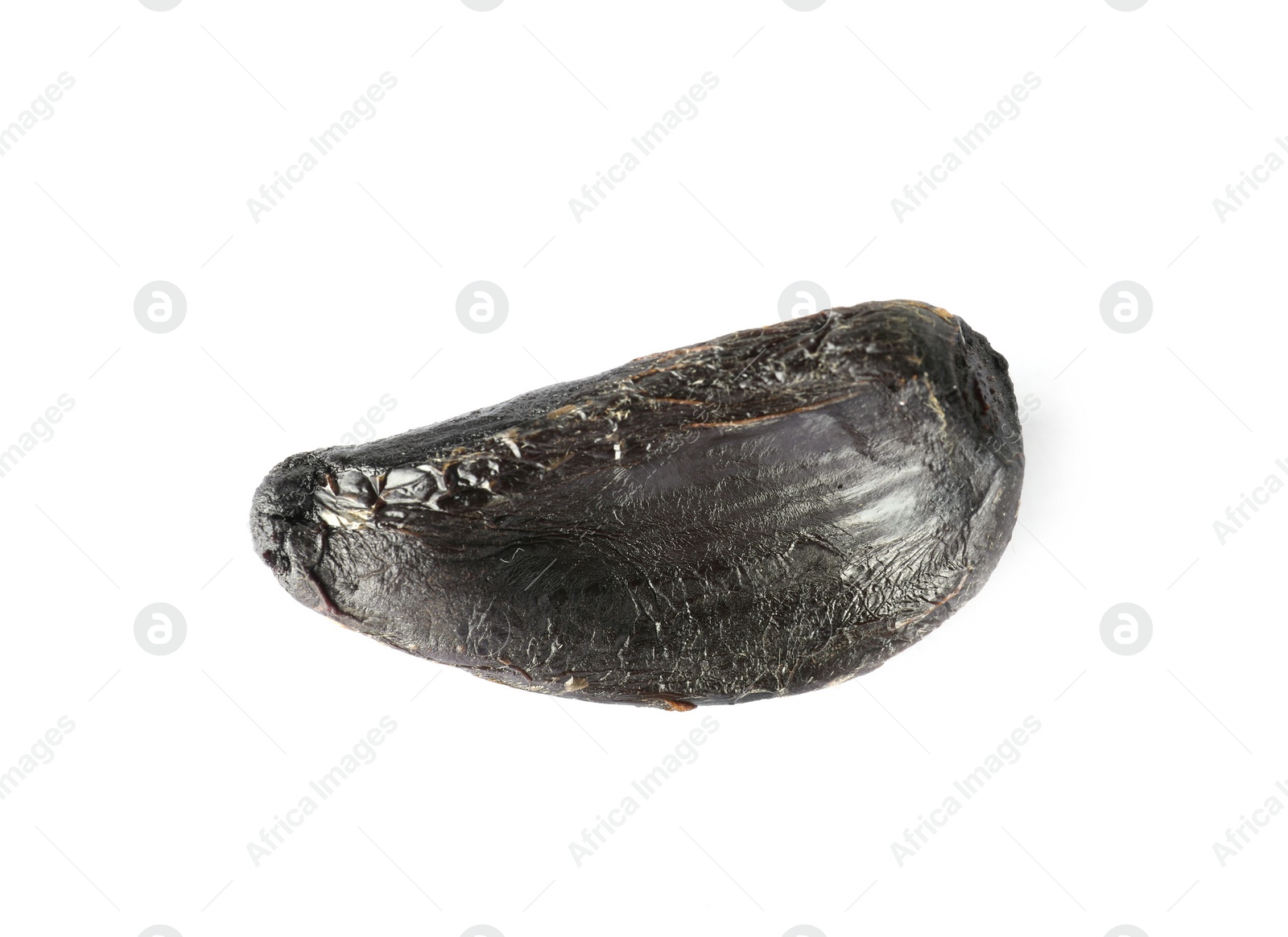 Photo of Clove of aged black garlic on white background