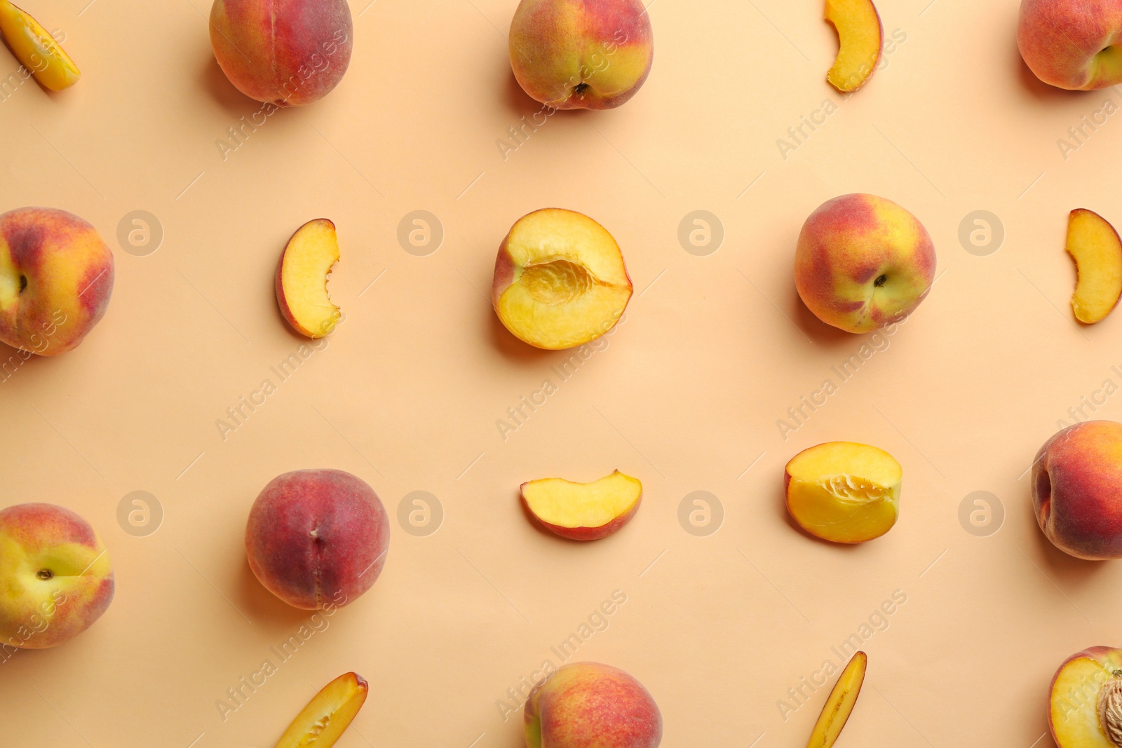 Photo of Flat lay composition with fresh peaches on beige background