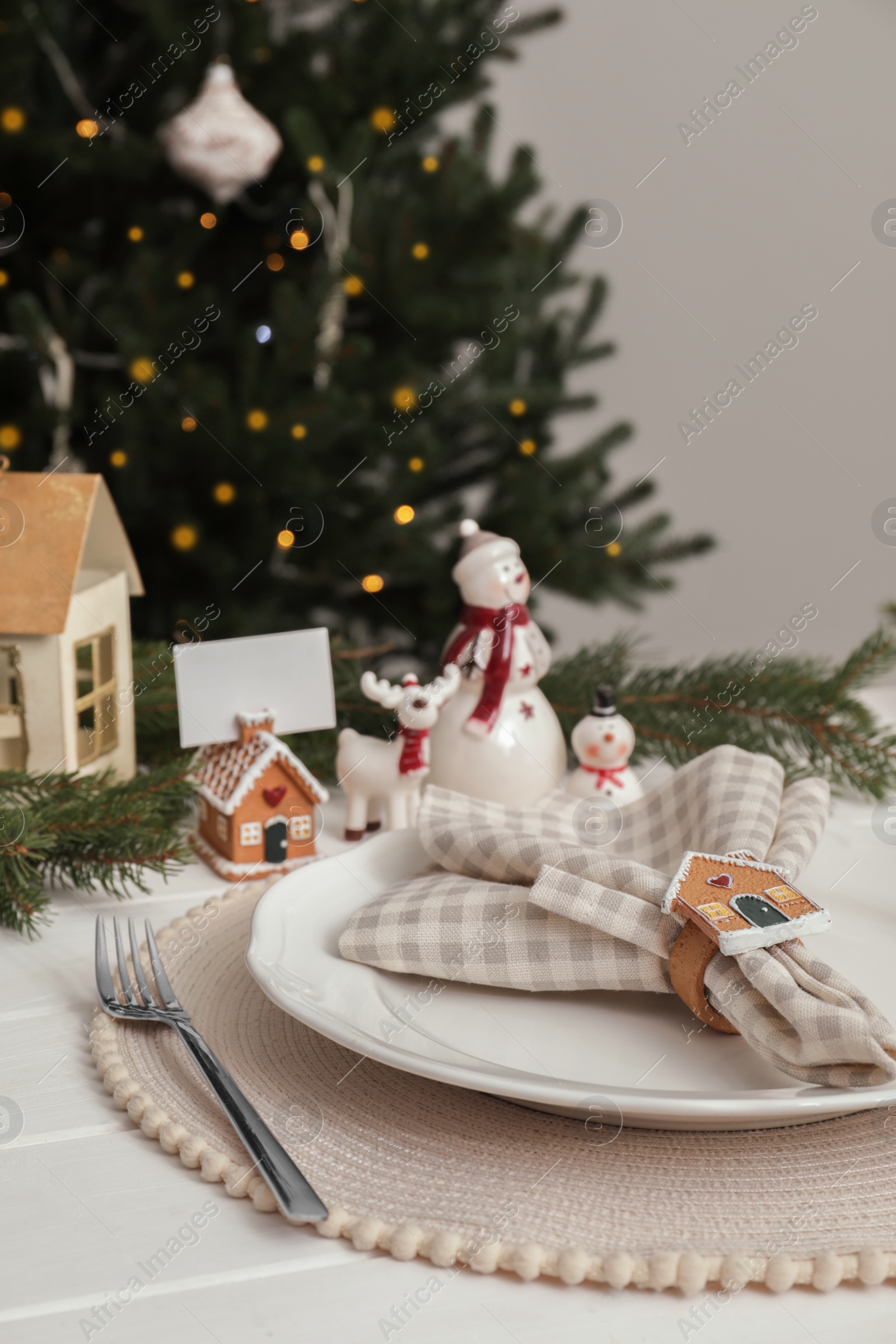 Photo of Luxury place setting with beautiful festive decor for Christmas dinner on white table