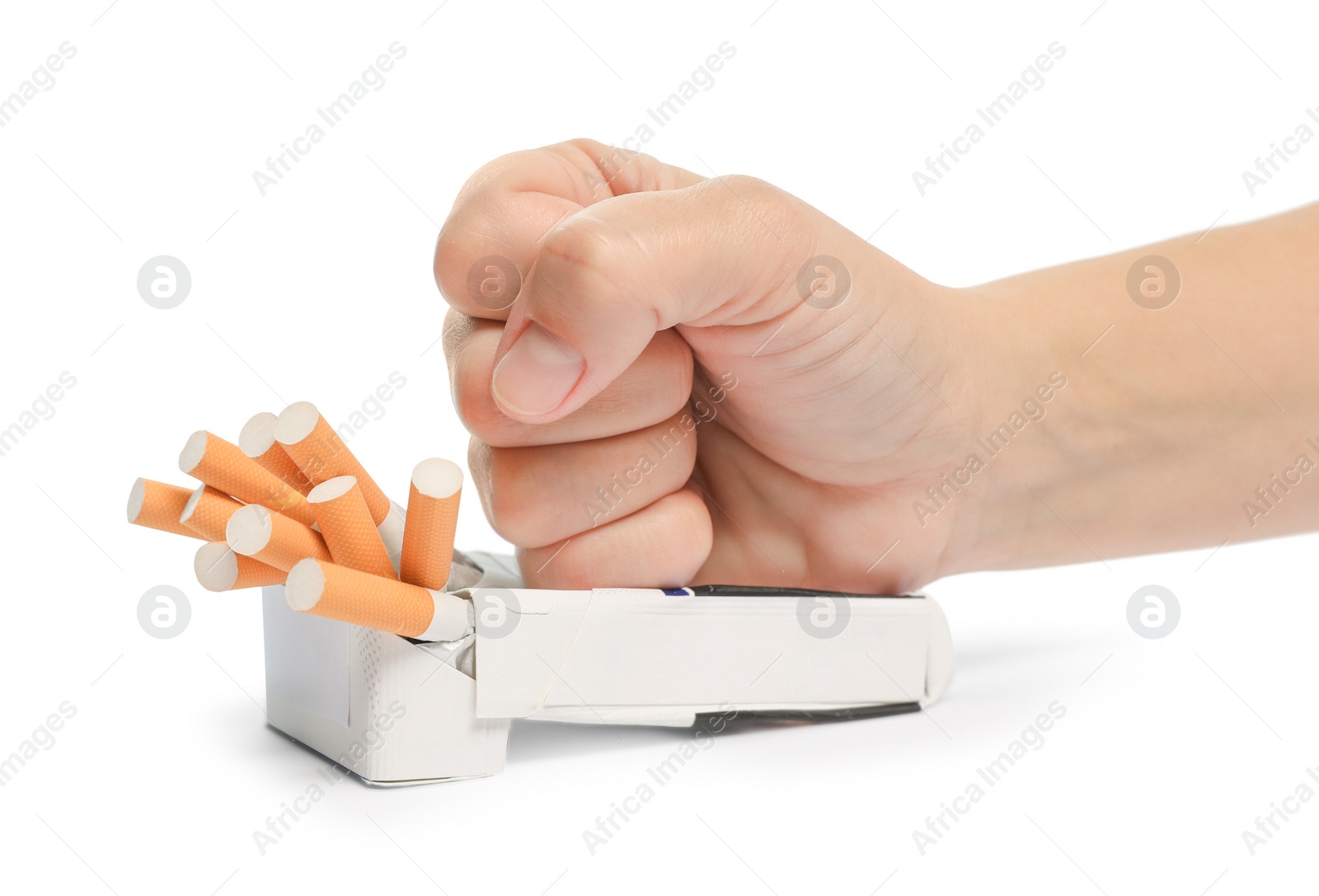 Photo of Stop smoking. Man crushing pack with cigarettes on white background, closeup