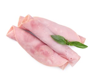 Photo of Rolled slices of tasty ham and basil isolated on white, top view