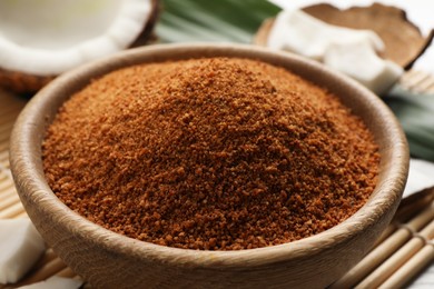 Natural coconut sugar in wooden bowl, closeup