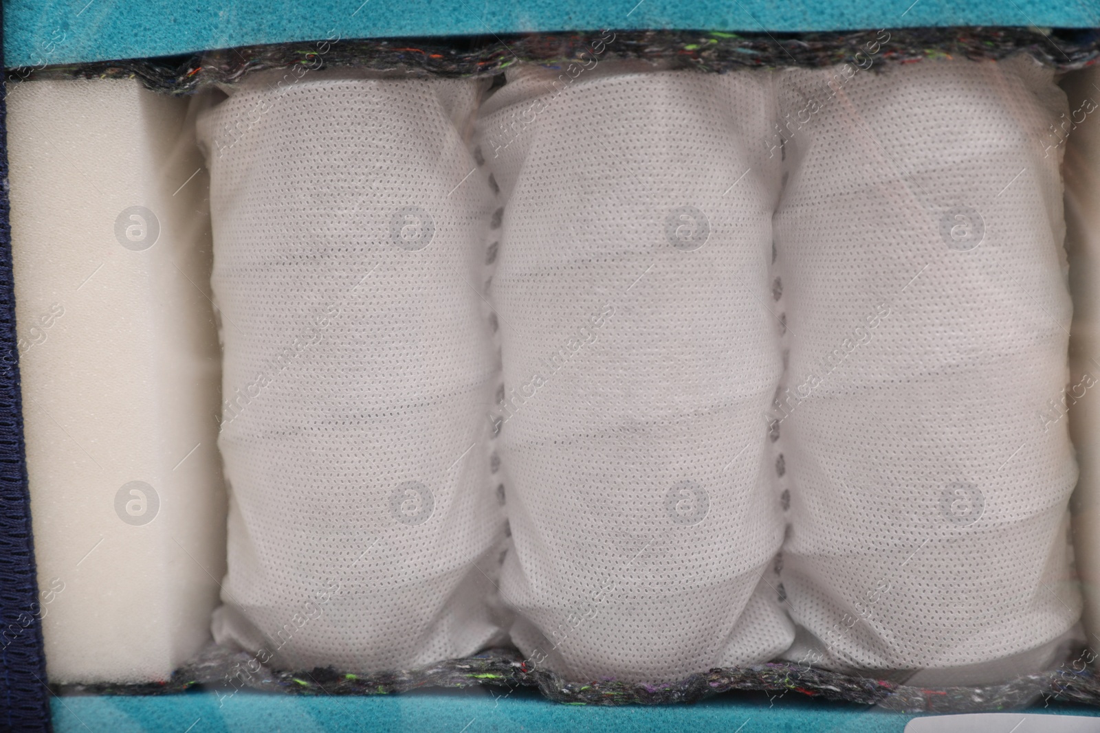 Image of Sample of modern orthopedic mattress as background, closeup