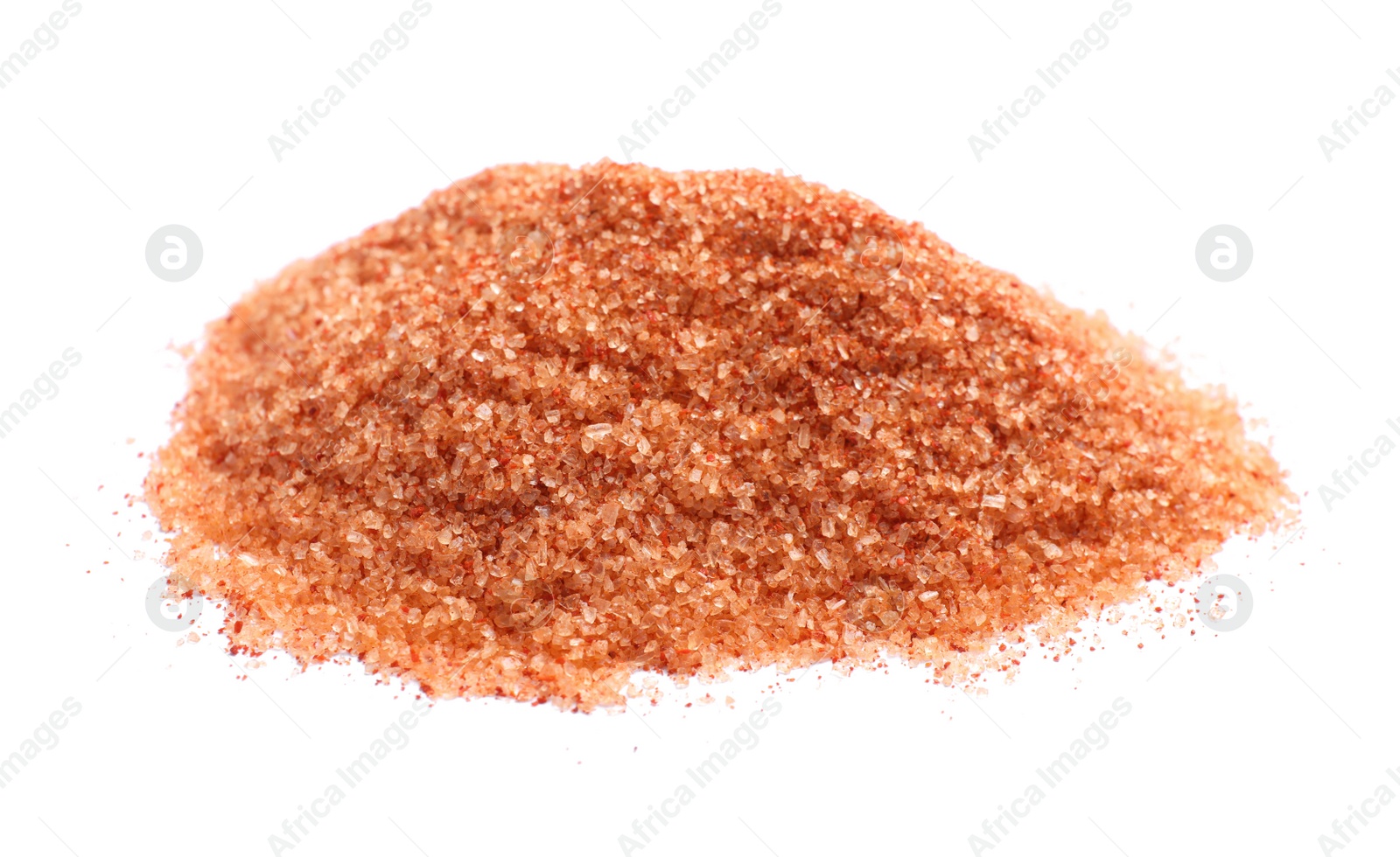 Photo of Heap of orange salt on white background