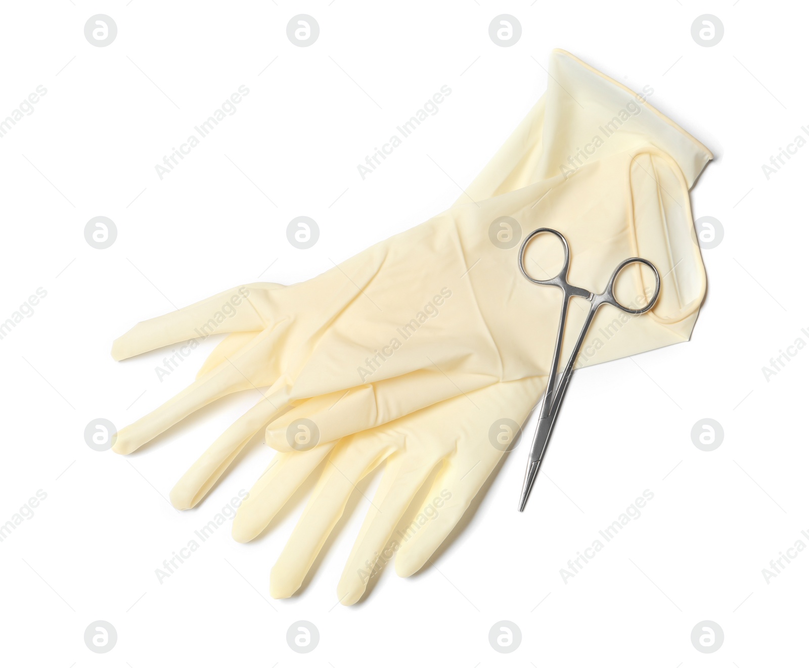 Photo of Protective gloves and medical clamp on white background, top view