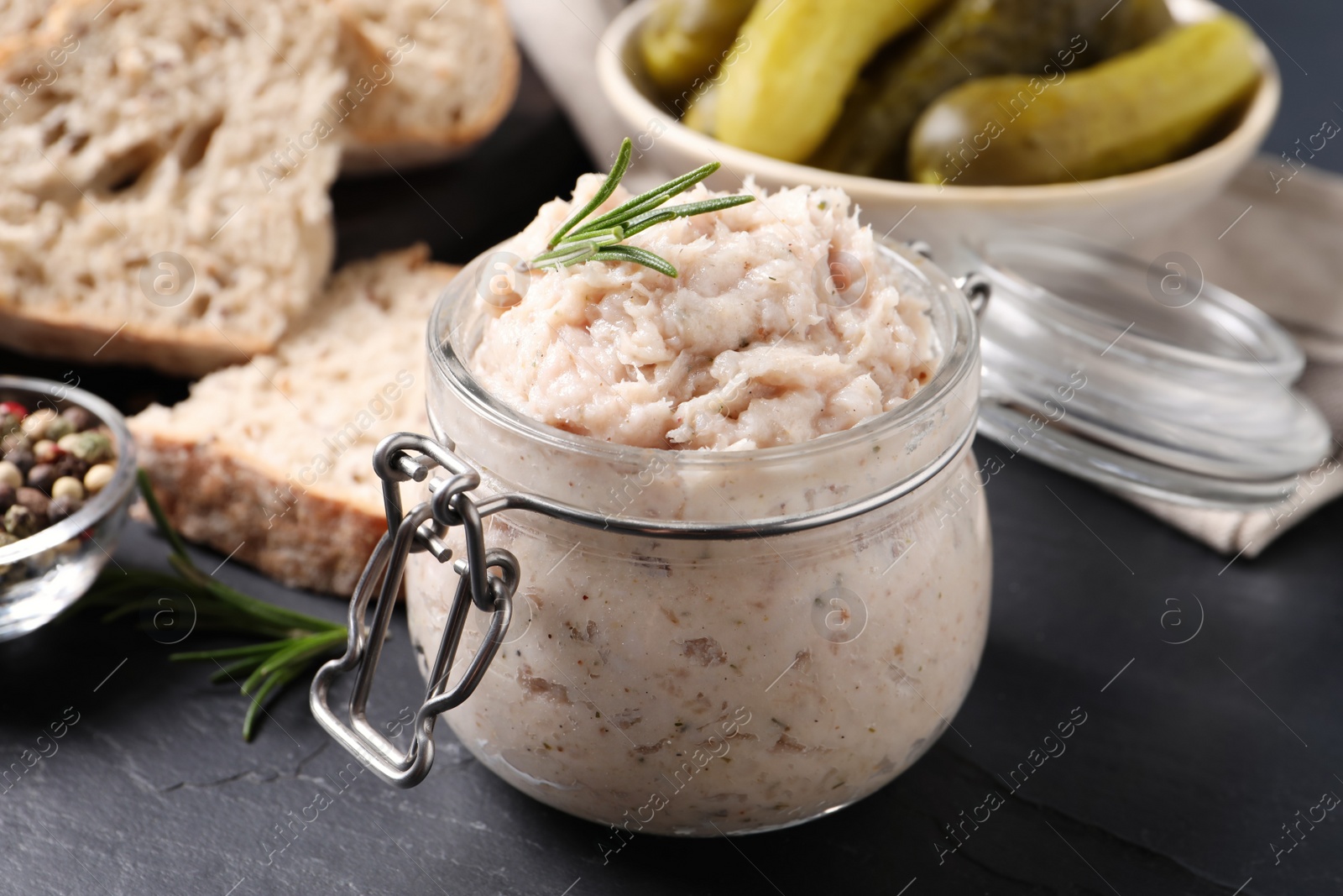 Photo of Delicious lard spread in jar on black table