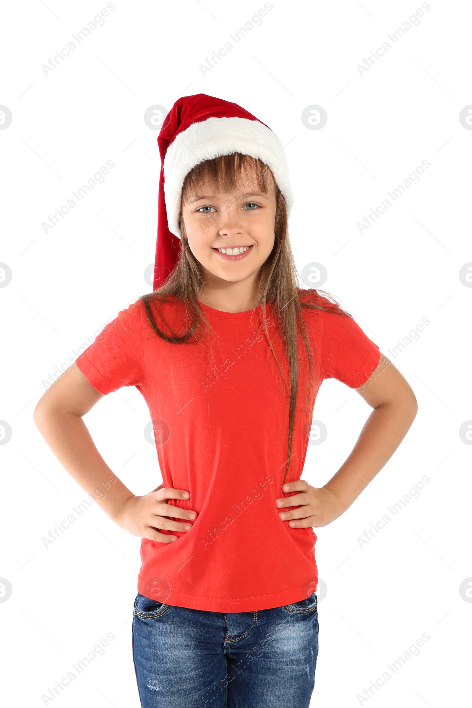 Photo of Cute little child in Santa hat on white background. Christmas celebration