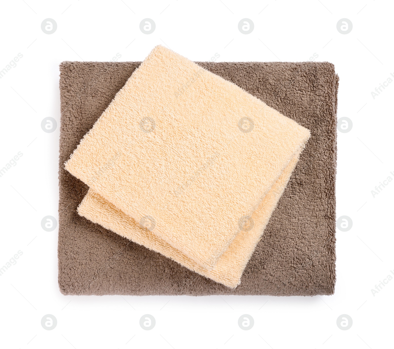 Photo of Soft colorful terry towels isolated on white, top view