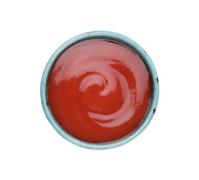 Photo of Bowl of tasty ketchup isolated on white, top view. Tomato sauce