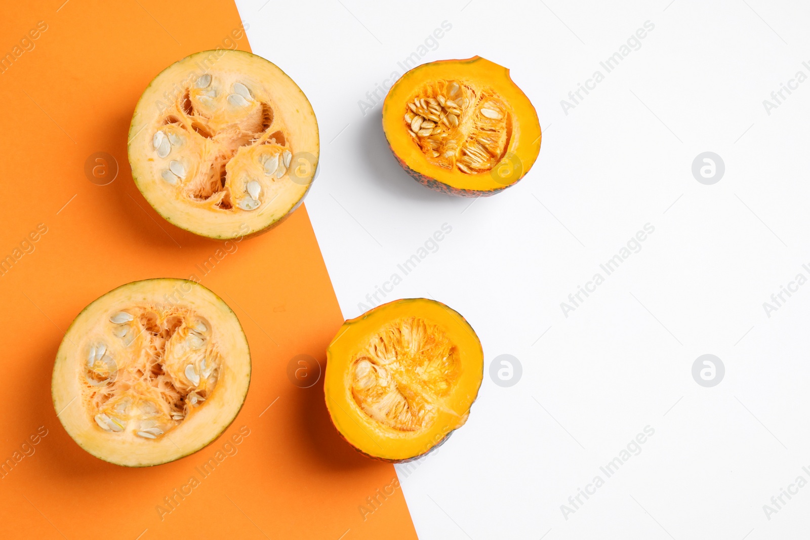 Photo of Fresh ripe pumpkins on color background, flat lay with space for text. Holiday decoration