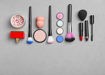 Photo of Flat lay composition with cosmetic products on grey background