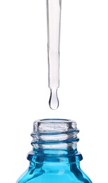 Photo of Dripping liquid from pipette into bottle isolated on white, closeup