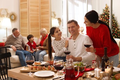 Happy family enjoying festive dinner at home. Christmas celebration