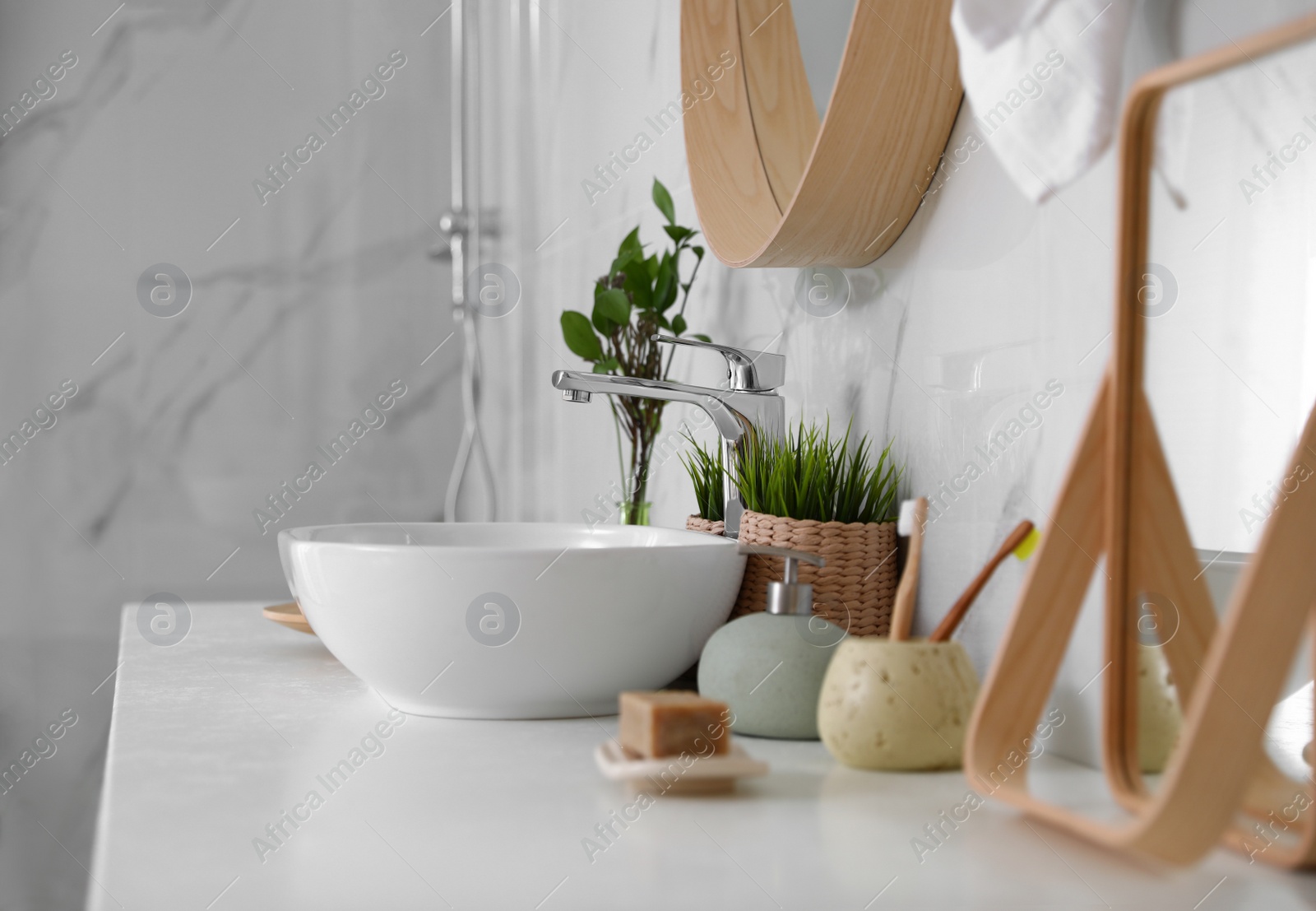 Photo of Modern bathroom interior with vessel sink and decor elements