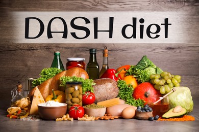 Dash diet (Dietary approaches to stop hypertension). Many different healthy food on grey table
