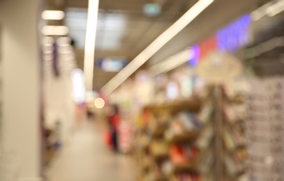 Photo of Blurred view of modern shopping mall interior