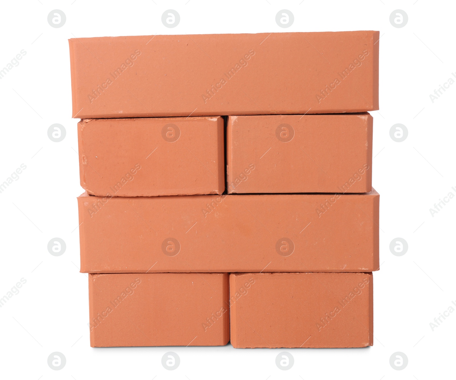 Photo of Many red bricks on white background. Building material