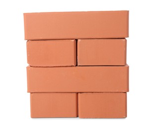 Many red bricks on white background. Building material