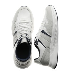 Pair of stylish sneakers on white background, top view