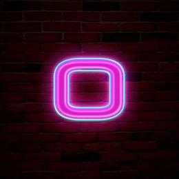 Image of Glowing neon number 0 sign on brick wall