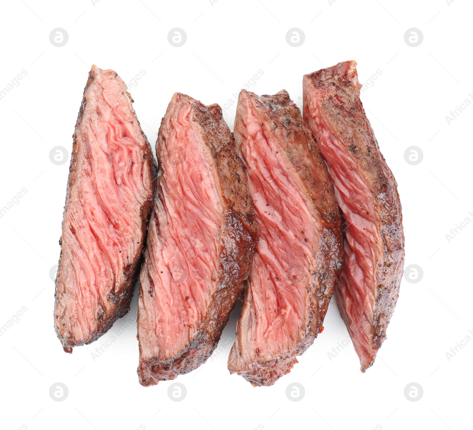 Photo of Slices of tasty grilled beef meat isolated on white, top view