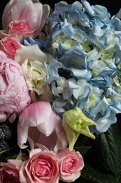 Photo of Beautiful fresh flowers on dark background, closeup