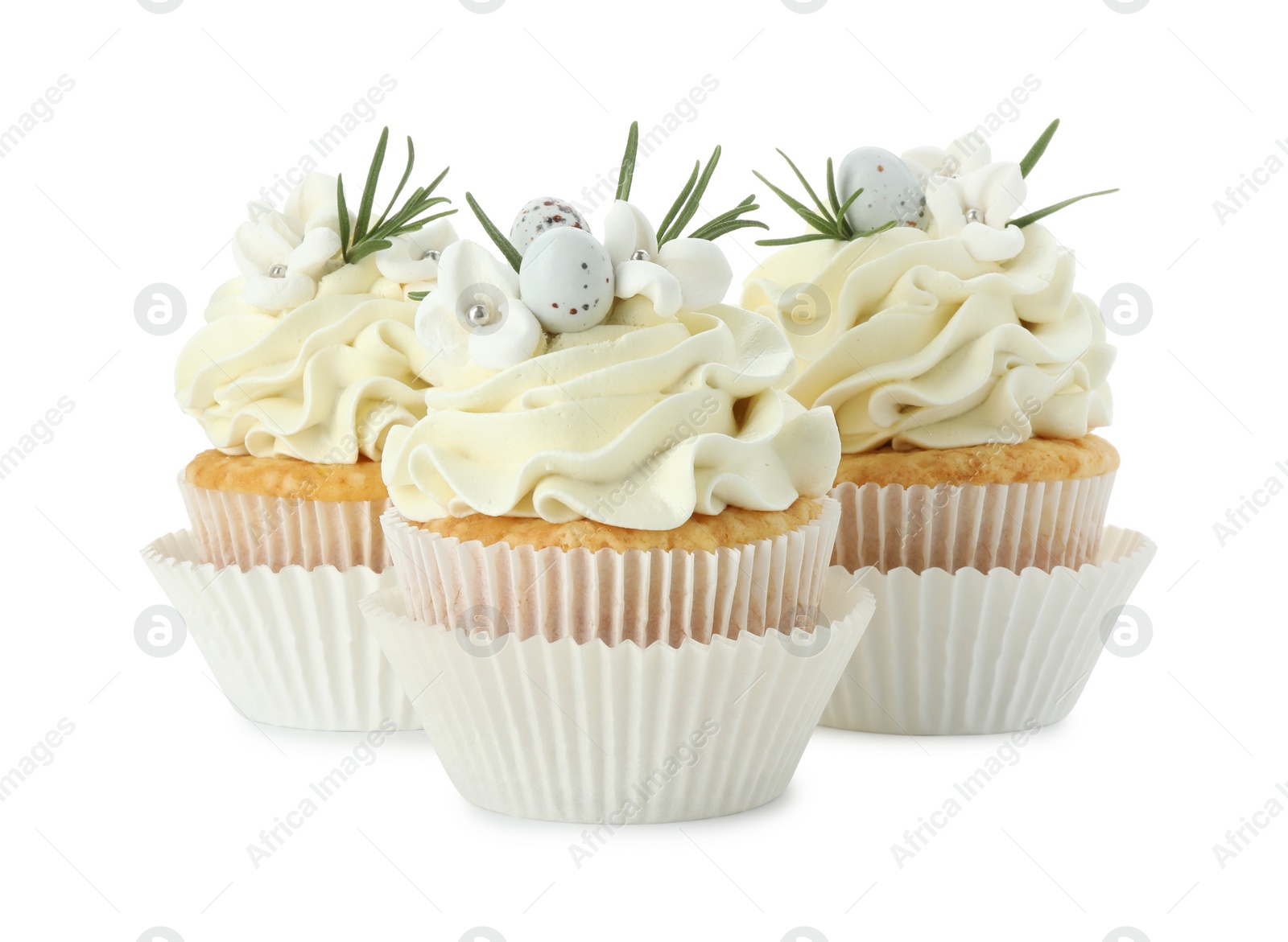 Photo of Tasty Easter cupcakes with vanilla cream isolated on white