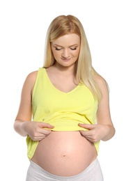 Photo of Beautiful pregnant woman showing her tummy on white background